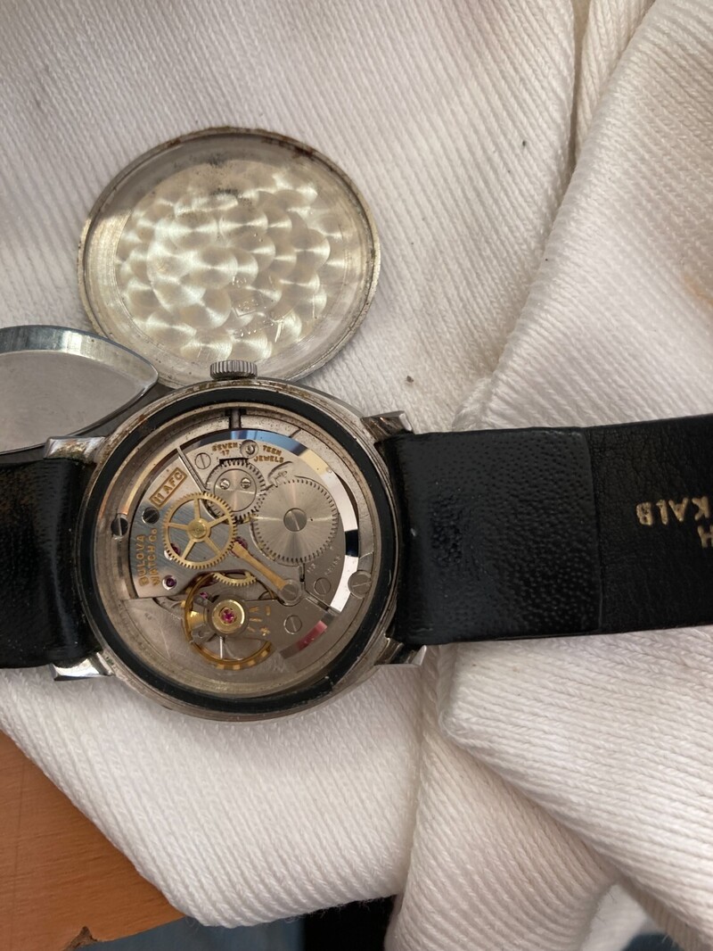 Rear of watch showing movement and insude back case