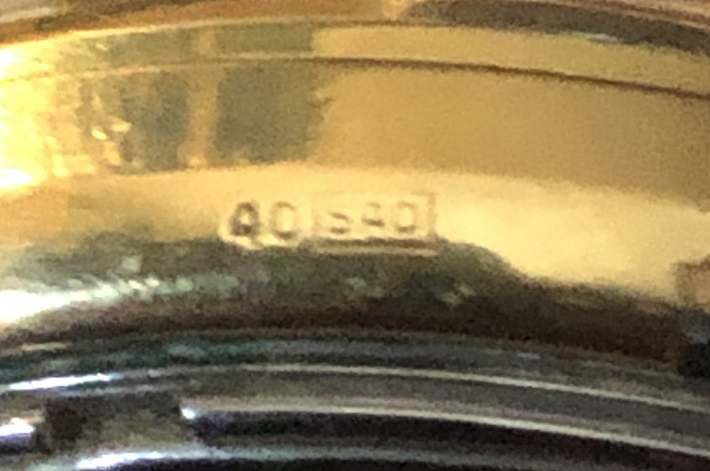Gold hallmark 40SAD on the side of a Bulova Accutron Date watch 1970
