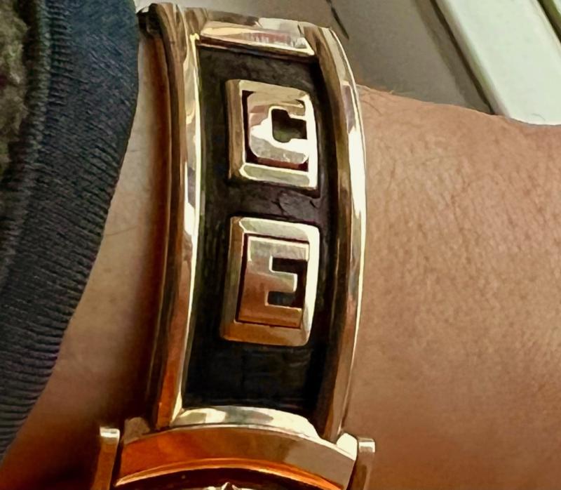 Funky monogramed band came with the watch.