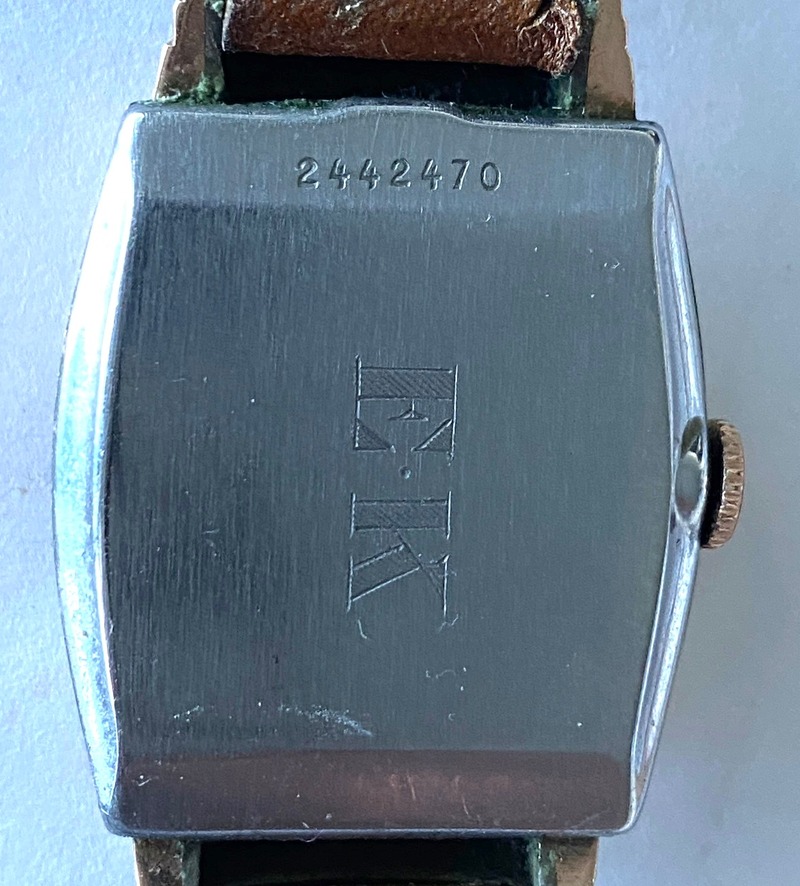 Back face 0f wrist watch showing case number